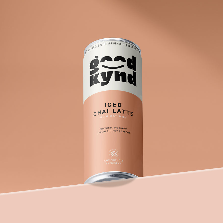 Below view of Good Kynd Chai can with prebiotics on peach-coloured background